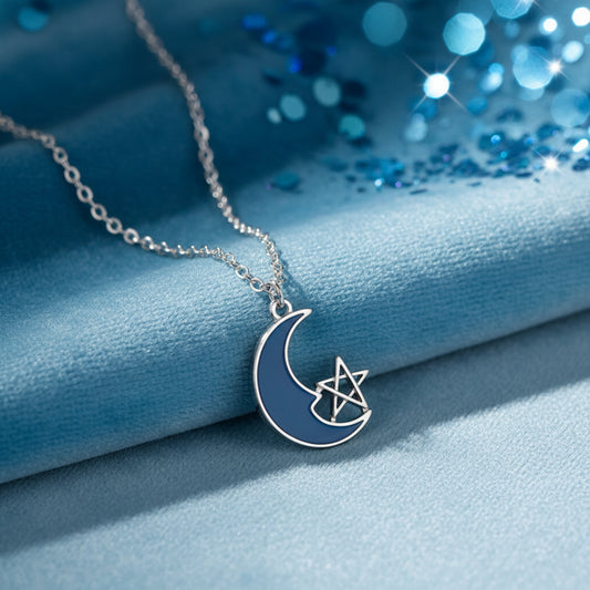 Blue Crescent Moon Star Necklace on a blue fabric background