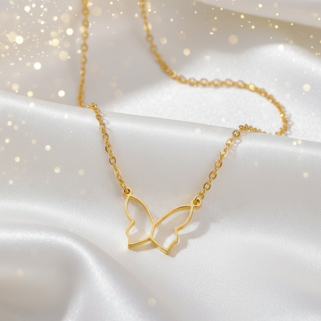Butterfly Gold Necklace on a white fabric background